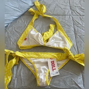 Chynna dolls matching two piece set yellow and white polka dot wavy trims.